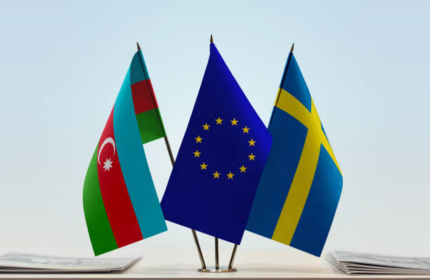 Flags of Azerbaijan and Sweden with a EU flag in the middle